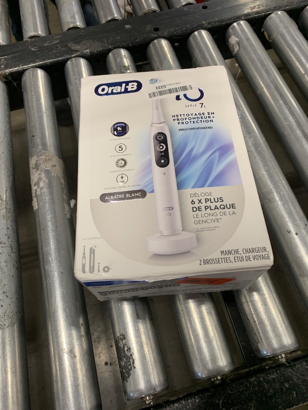 Photo 1 of Oral-B iO Deep Clean + Protect Rechargeable Electric Toothbrush, White with a iO Series 7 Toothbrush, 2 Replacement Brush Heads, and a Charging Travel Case