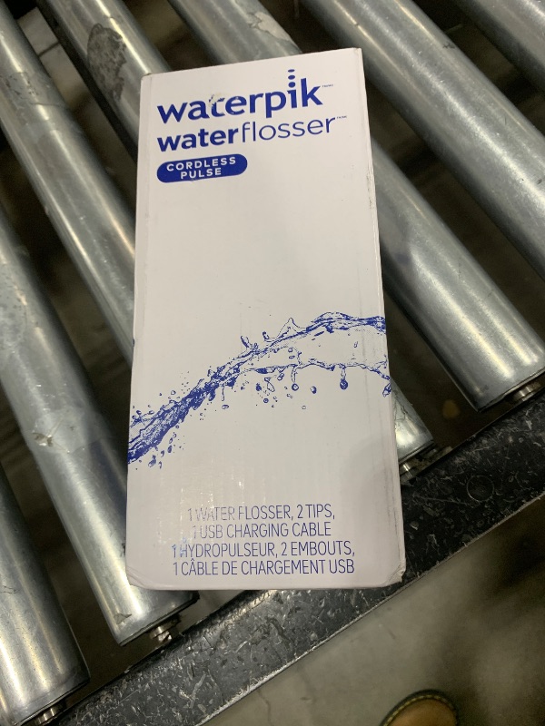 Photo 1 of Waterpik Cordless Pulse Rechargeable Portable Water Flosser for Teeth, Gums, Braces Care and Travel with 2 Flossing Tips, Waterproof, ADA Accepted, WF-20 Blue, Packaging May Vary