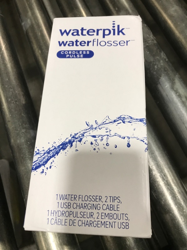 Photo 1 of Waterpik Cordless Pulse Rechargeable Portable Water Flosser for Teeth, Gums, Braces Care and Travel with 2 Flossing Tips, Waterproof, ADA Accepted, WF-20 White, Packaging May Vary