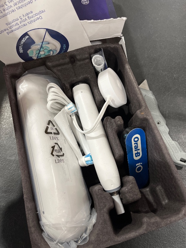 Photo 2 of Oral-B iO Series 9 Electric Toothbrush with 3 Replacement Brush Heads, White Alabaster