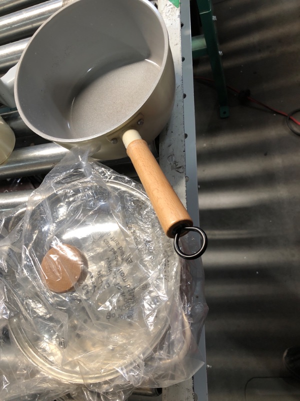 Photo 1 of ***(HEAVILY USED)***
ROCKURWOK Ceramic Nonstick Sauce Pan, 3 QT Pot with Steamer, Non Toxic & PFAS-Free, Wooden Handle for Cool Touch, Universal Base(Gas, Electric & Induction), White