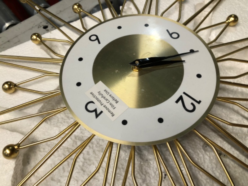 Photo 1 of ***DAMAGED - ARMS BENT - NO BATTERY - UNABLE TO TEST - SEE PICTURES***
Lafocuse 23 Inch Metal Gold Starburst Wall Clock, Large Mid Century Modern Wall Clocks, Art Deco Wall Clocks for Living Room Kitchen Office