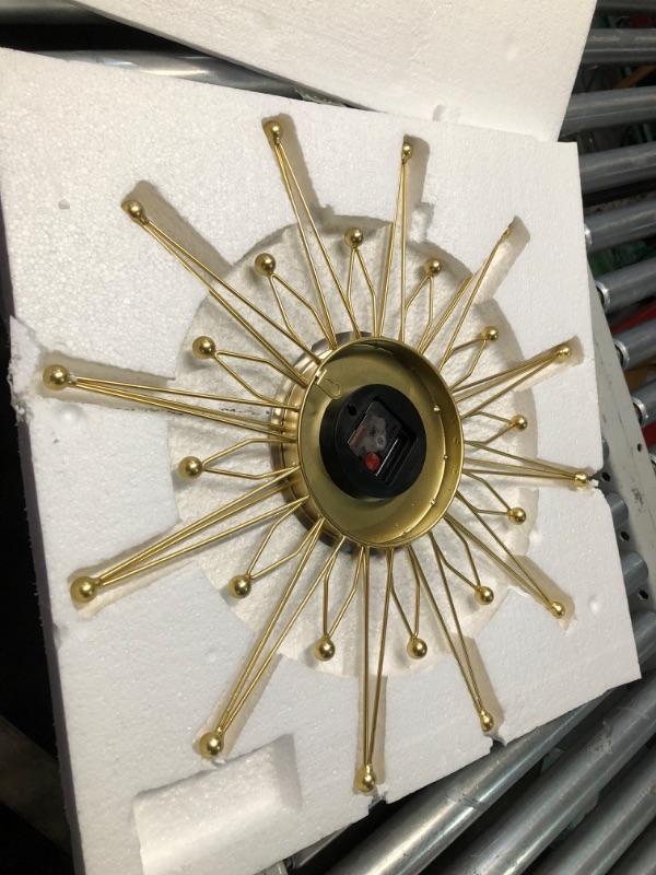 Photo 1 of ***DAMAGED - ARMS BENT - NO BATTERY - UNABLE TO TEST - SEE PICTURES***
Lafocuse 23 Inch Metal Gold Starburst Wall Clock, Large Mid Century Modern Wall Clocks, Art Deco Wall Clocks for Living Room Kitchen Office