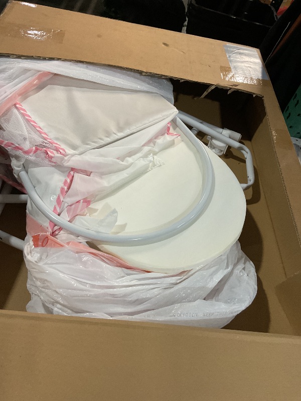 Photo 1 of (Used)(see all images)Dream On Me Lacy Portable 2-in-1 Bassinet & Cradle in Pink and White, Lightweight Baby Bassinet with Storage Basket, Adjustable and Removable Canopy