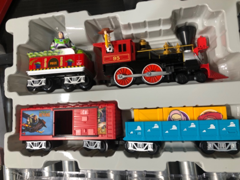 Photo 1 of Lionel Battery-Operated Disney Toy Story Toy Train Set with Locomotive, Train Cars, Track & Remote with Authentic Train Sounds, & Lights for Kids 4+