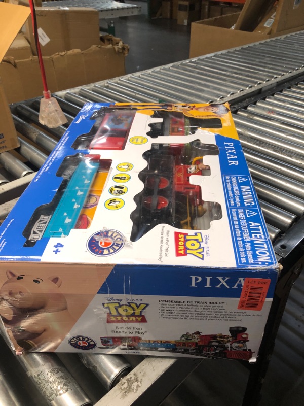 Photo 1 of Lionel Battery-Operated Disney Toy Story Toy Train Set with Locomotive, Train Cars, Track & Remote with Authentic Train Sounds, & Lights for Kids 4+