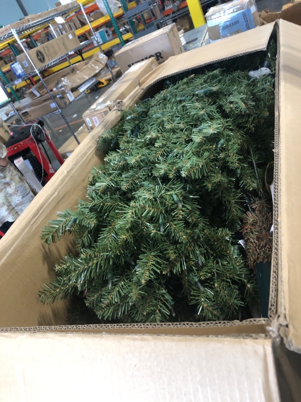 Photo 1 of Puleo International 10 Foot Pre-Lit Slim Fraser Fir Artificial Christmas Tree with 900 UL Listed Clear Lights, Green