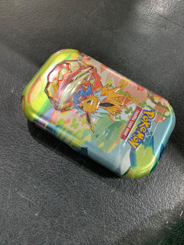Photo 1 of Pokémon TCG: Scarlet & Violet—Prismatic Evolutions Mini Tin – Jolteon (2 Booster Packs & 1 Coin)