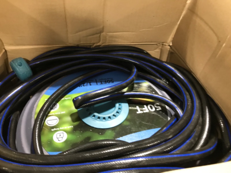Photo 1 of Tuzoc Retractable Garden Hose Reel, Wall-Mounted Hose Reel 1/2 in x 50 ft, Slow Retraction System, Any Length Lock, 180°Swivel Water Hose Reel with 10 Function Nozzle