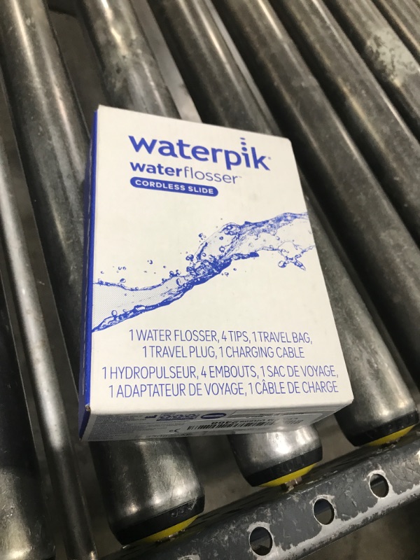 Photo 1 of Waterpik Cordless Slide Professional Water Flosser, Portable Collapsible for Travel and Storage, with Travel Bag and 4 Tips, ADA Accepted, Rechargeable and Waterproof, White WF-17CD010-1