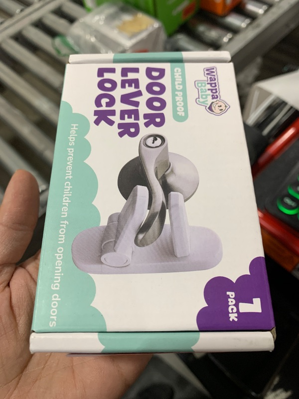Photo 1 of Door Lever Lock (1 Pack) Prevents Toddlers from Opening Doors. 3.25" L * 1.5" W * 4.5" H Easy One Hand Operation for Adults. Durable ABS with 3M Adhesive Backing. Simple Install, No Tools Needed.