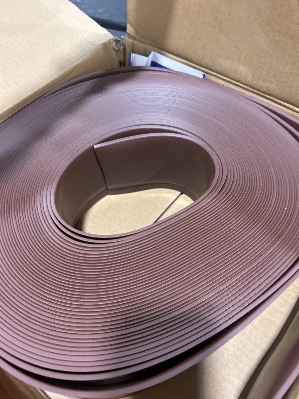 Photo 1 of FONUNO Vinyl Wall Base Baseboard Molding Trim 4" Flexible Self Adhesive Rubber Wall Base Moulding Trim Peel and Stick Design, 4 Inch x 100 Feet, Brown