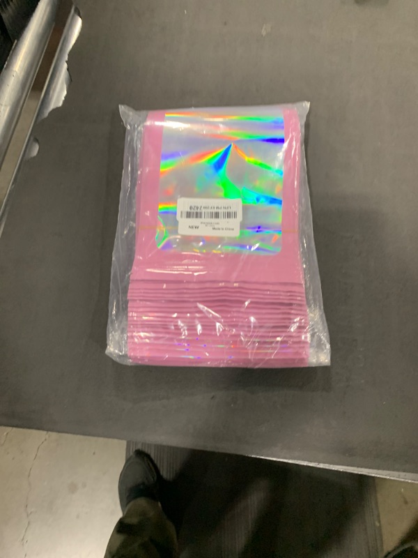 Photo 1 of 100 Pieces Resealable Mylar Bags, Small Holographic Packaging Bags, Smell Proof Mylar Bags for Food Storage/Jewelry/Eyelash for Small Business (Pink, 6.3x9.4 Inch)