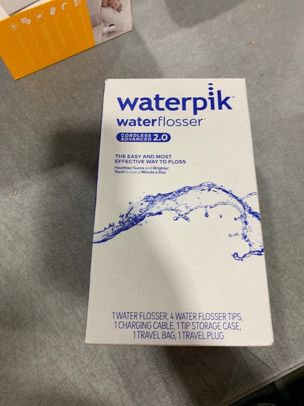 Photo 1 of Waterpik Cordless Advanced 2.0 Water Flosser For Teeth, Gums, Braces, Dental Care With Travel Bag and 4 Tips, ADA Accepted, Rechargeable, Portable, and Waterproof, Blue WP-583, Packaging May Vary
