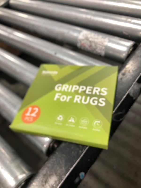 Photo 1 of Rabenda 12 Pcs Rug Tape, Non Slip Rug Pads Grippers for Hardwood Floors and Tiles, Reusable Carpet Tape for Area Rugs, Double-Sided Adhesive Rug Stickers Keep Corners Flat (Black)