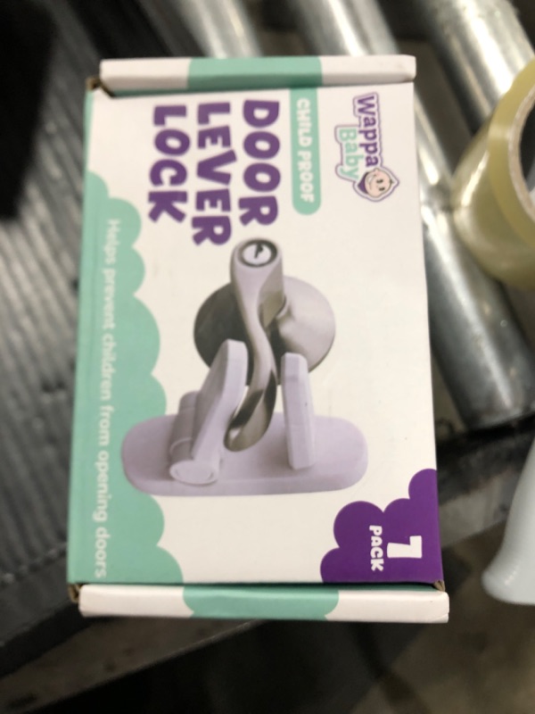 Photo 1 of Door Lever Lock (1 Pack) Prevents Toddlers from Opening Doors. 3.25" L * 1.5" W * 4.5" H Easy One Hand Operation for Adults. Durable ABS with 3M Adhesive Backing. Simple Install, No Tools Needed.