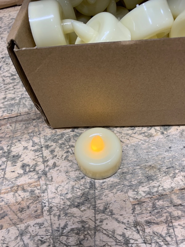 Photo 1 of Amagic 50Pack Flameless LED Tea Lights Candles Battery Operated, Electric Fake Tealight Candles for Votive, Halloween, Christmas, Home Decor, Wedding, Table Decor (50Pack)
