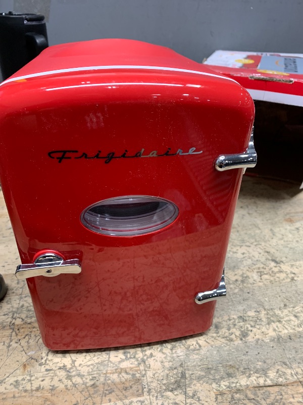 Photo 1 of Frigidaire Red Mini Personal Fridge Cooler, 1 Gal Capacity fits Six Cans, Includes Plugs for Home Outlet & DC Charger - 9.84" D x 7.09" W x 10.35" H