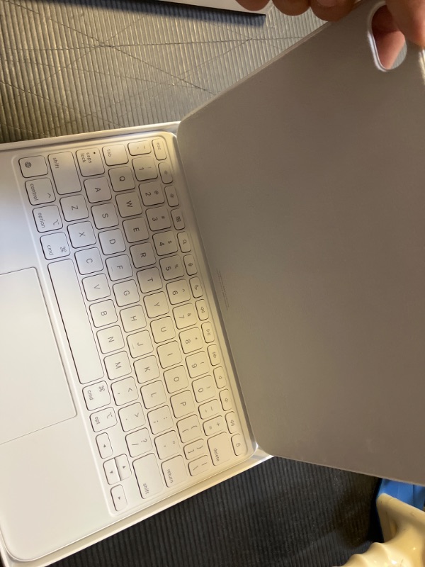 Photo 1 of Apple Magic Keyboard Folio: iPad Keyboard and case for iPad (A16 and 10th Generation), Detachable Two-Piece Design That attaches magnetically, Built-in trackpad, US English – White
