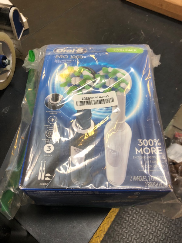 Photo 1 of Oral-B Pro 1000 CrossAction Electric Toothbrush, Black and White, 2 Count