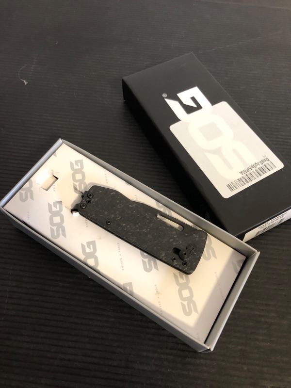 Photo 1 of SOG Ultra XR XHP Lightweight Slim 6.5mm Folding Knife | CRYO CTS XHP Stainless Steel Blade and Carbon Fiber Handle, XR Lock