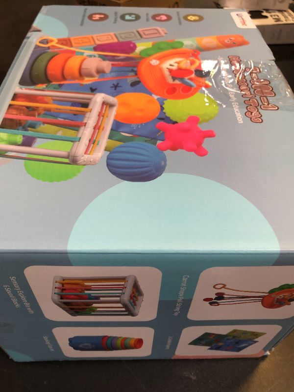 Photo 1 of Baby Toys 6 to12 Months, 7 in-1 Montessori Toy for 6-9-12-18 Month Old with Pull String Toy, Sensory Bin Toys, Stacking Baby Blocks & Soft Infant Ring & Sensory Ball, Stacking Cups for Toddler Gift