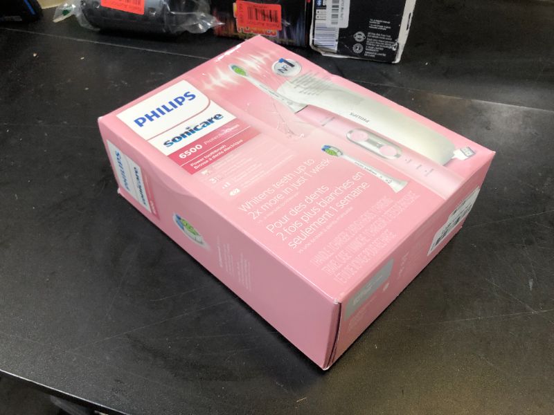 Photo 1 of Philips Sonicare ProtectiveClean 6500 Rechargeable Electric Toothbrush, with Pressure Sensor, 3 Cleaning Modes, SmarTimer and QuadPacer, 14-Day Battery Life, Charging Travel Case, Pink, HX6462/06