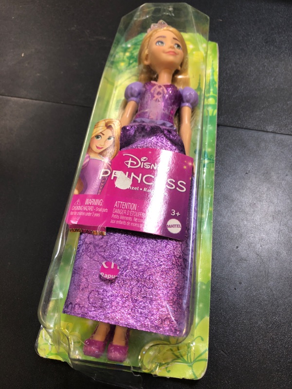 Photo 1 of Mattel Disney Princess Toys, Rapunzel Fashion Doll, Sparkling Look with Blonde Hair, Blue Eyes & Tiara Accessory, Inspired by the Movie Tangled