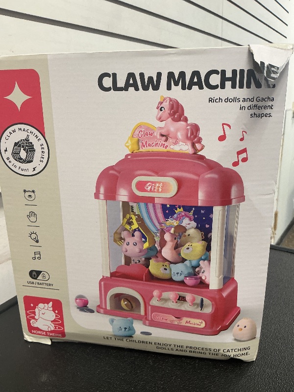 Photo 1 of AIQI 60 PCS Unicorn Kids Claw Machine, Vending Claw Machine with Lights Sound, Candy and Prize Electronic Dispenser Game Toys for Kids, Claw Machine Toys for 3 4 5 6 7 8 Years Old Girls