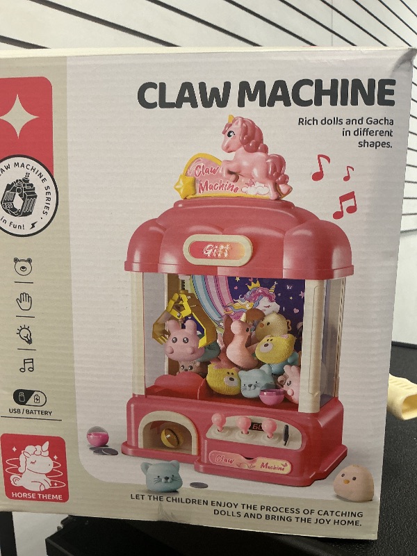 Photo 1 of AIQI 60 PCS Unicorn Kids Claw Machine, Vending Claw Machine with Lights Sound, Candy and Prize Electronic Dispenser Game Toys for Kids, Claw Machine Toys for 3 4 5 6 7 8 Years Old Girls