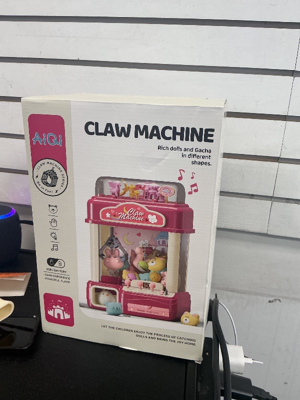 Photo 1 of AIQI Kids Claw Machine, Large Candy Vending Grabber, Prize Dispenser Toys for Girls and Boys, Electronic Claw Game Machine for Party Birthdays with Lights Sound, Includes 30 Toys and 25 Game Coins