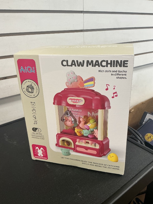 Photo 1 of Aiqi Bear Kids Claw Machine,Candy Vending Grabber,Prize Dispenser Toys for Girls and Boys,Electronic Game Machine Party Birthdays with Lights Sound,Includes 30 Toys and 25 Game Coins