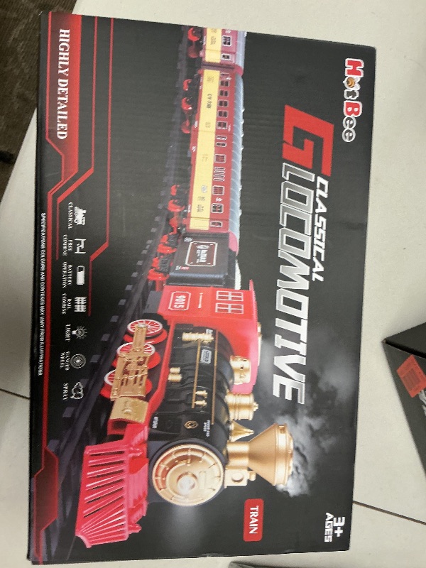 Photo 1 of Hot Bee Christmas Train Set,Train Set for Toddlers 2-4,Christmas Train Sets for Around The Tree,Steam Locomotive with Lights,Sounds,and Spray,Easy Setup Train Toy,Perfect Train Set for Kids Ages 4-8