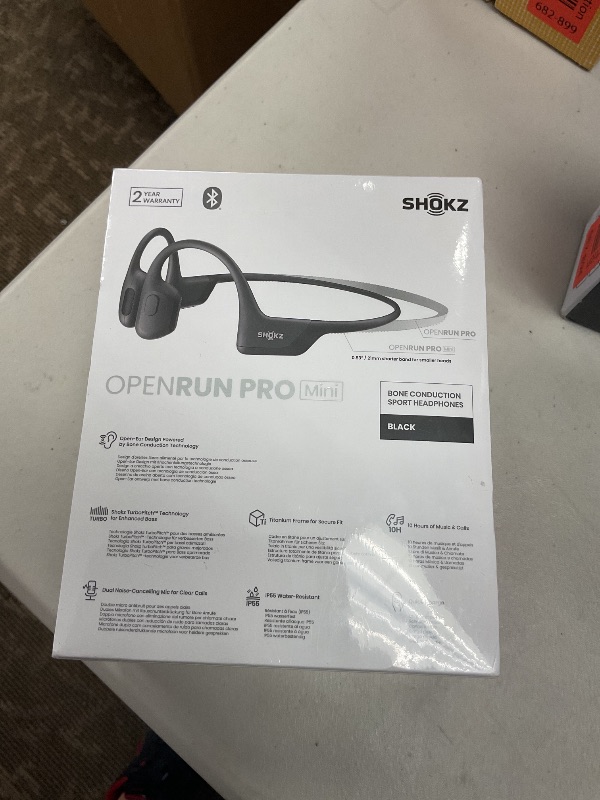 Photo 1 of SHOKZ OpenMove - Open-Ear Bluetooth Sport Headphones, Bone Conduction Wireless Earphones, Sweatproof for Running and Workouts, with Sticker Pack (Pink)