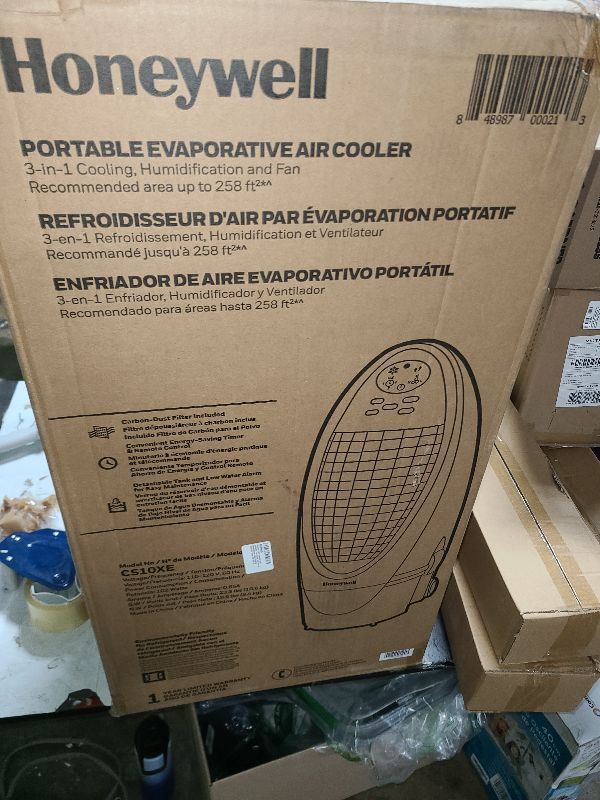 Photo 1 of Honeywell 300 CFM Indoor Portable Evaporative Cooler, Fan & Humidifier with Detachable Tank, Carbon Dust Filter & Remote Control, Silver/Gray