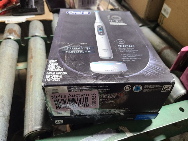 Photo 1 of Oral-B iO Series 10 Rechargeable Electric Toothbrush with Visible Pressure Sensor to Protect Gums, 2 Min Timer, 7 Cleaning Settings, 4 Replacement Toothbrush Heads, and Charging Travel Case, White