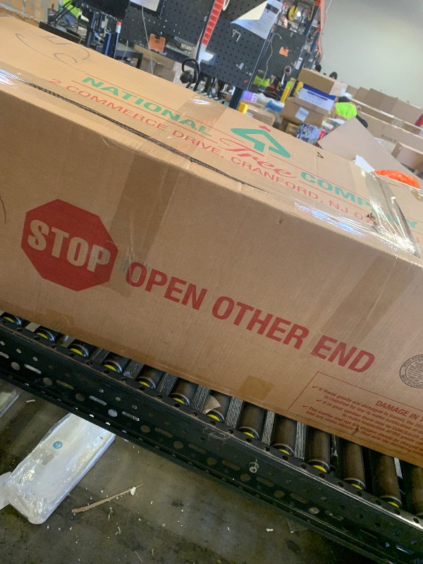 Photo 1 of National Tree Company 7.5 ft Pre-Lit Jersey Fraser Fir Artificial Christmas Tree, 1,250 Clear Lights, 3,144 Tips, Includes Stand, Green