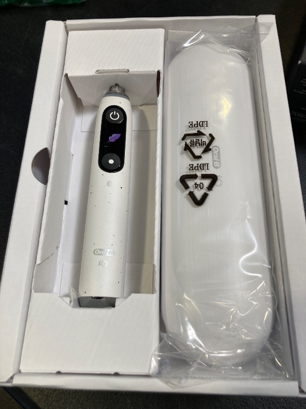 Photo 1 of Oral-B iO Series 10 Rechargeable Electric Toothbrush with Visible Pressure Sensor to Protect Gums, 2 Min Timer, 7 Cleaning Settings, 4 Replacement Toothbrush Heads, and Charging Travel Case, White