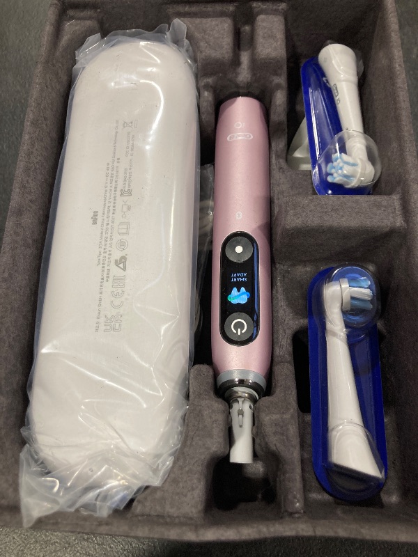 Photo 1 of Oral-B iO Series 9 Limited Rechargeable Rose Quartz Electric Toothbrush with (2) Ultimate Clean and (1) Gentle Care Replacement Brush Heads, White, Travel Case-White and Charger