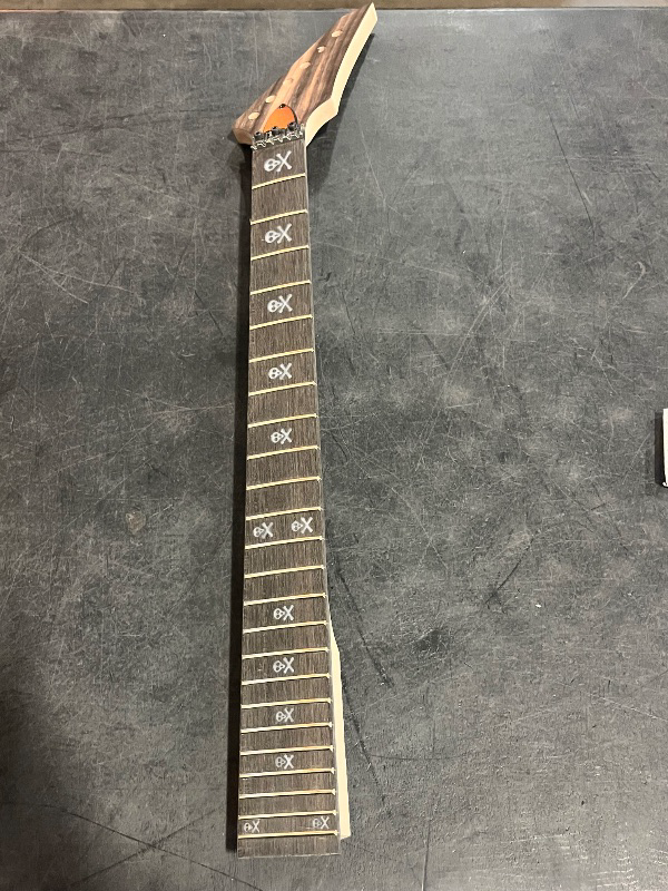 Photo 1 of Maple Guitar Neck 24 Fret 25.5 Inch - Black Finish with White Skull Inlays, Pointed Headstock & Bolt-On Heel for Modern Electric Guitar Builds