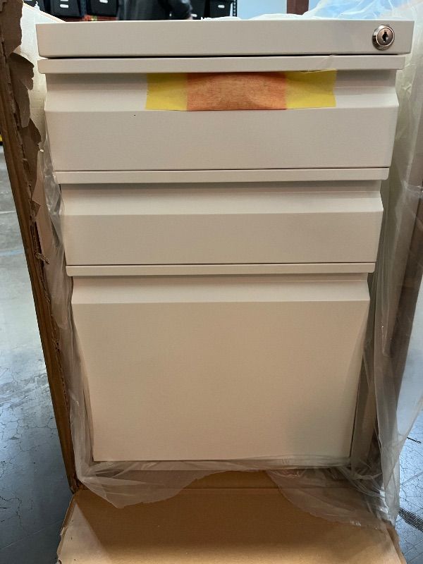 Photo 1 of Mount-It! 3 Drawer File Cabinet with Lock and Wheels, Under Desk Storage Filing Pedestal for Home Office, No Assembly Small Rolling File Cabinet for Legal, Letter, and A4 Files in White
