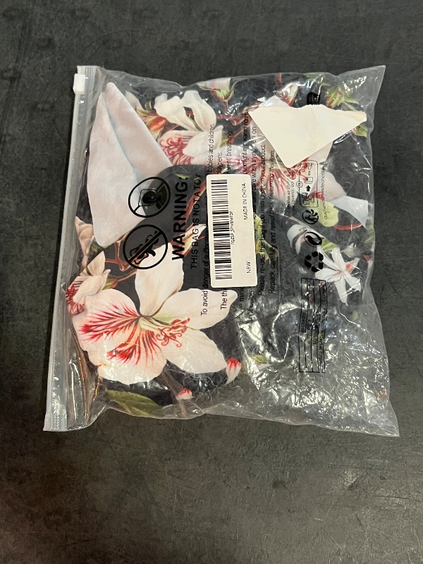 Photo 1 of (S) Kona Sol Womens Bandeau Flounce Front Ruchell Full Coverage One Piece Suit Features a Tropical Floral Pattern on Black Background