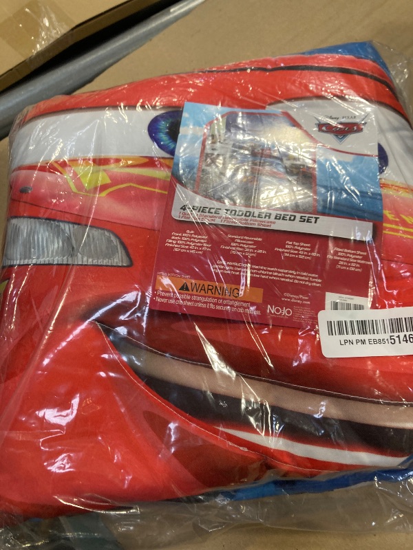 Photo 1 of Disney Cars Piston Cup Circuit Blue, Red, and Yellow, Lightning McQueen and Mater 4 Piece Toddler Bed Set - Comforter, Fitted Bottom Sheet, Flat Top Sheet, and Reversible Pillowcase