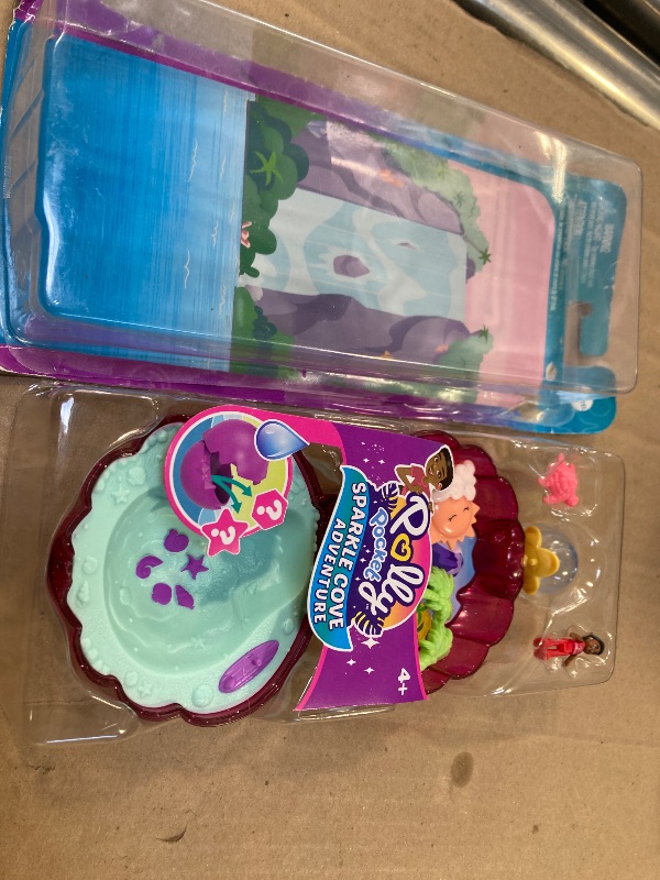 Photo 1 of Polly Pocket Dolls & Accessories, Sparkle Beach Shell Compact with Micro Doll & Ocean Pet, Travel Toy with Water Play,