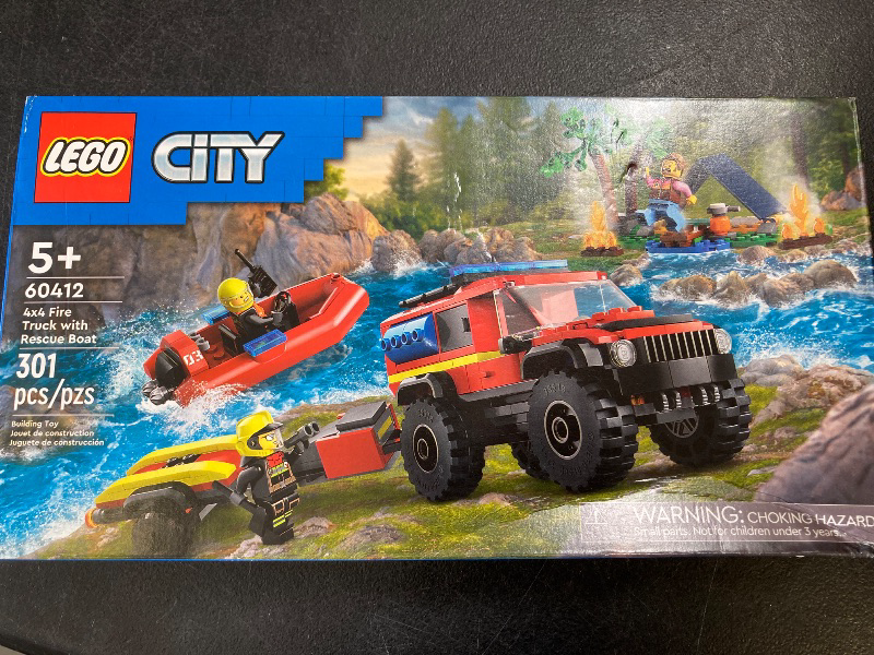Photo 1 of LEGO City 4x4 Fire Truck with Rescue Boat Toy for Kids Ages 5 and Up, Pretend Play Toy for Boys and Girls with a Truck Toy, Trailer, Dinghy and Tent, Plus 1 Camper and 2 Firefighter Minifigures, 60412