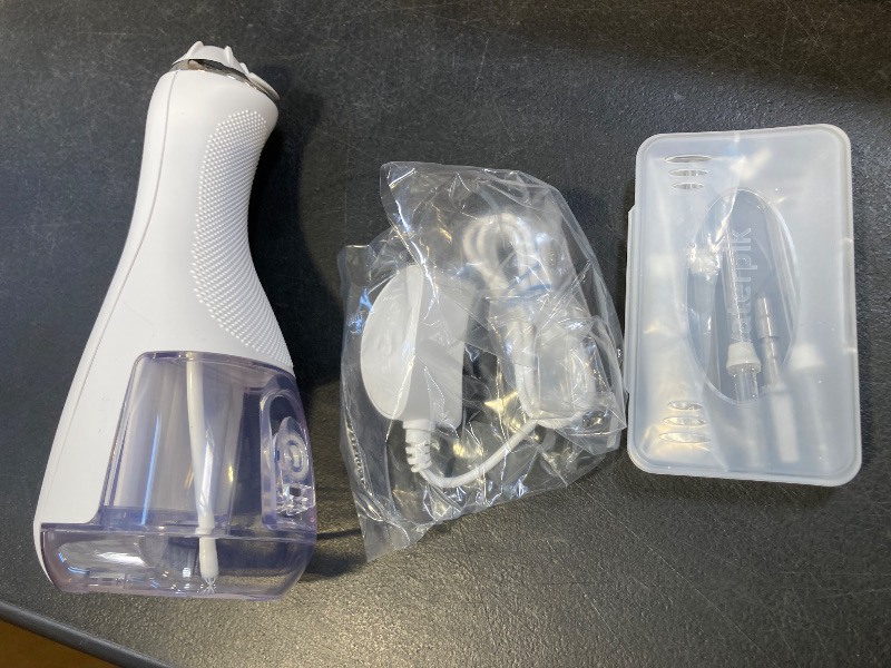 Photo 1 of Waterpik Cordless Advanced 2.0 Water Flosser For Teeth, Gums, Braces, Dental Care With Travel Bag and 4 Tips, ADA Accepted, Rechargeable, Portable, and Waterproof, White WP-580, Packaging May Vary