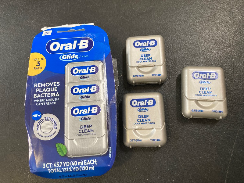 Photo 1 of Oral-B Glide Dental Floss, Shred Resistant, Gentle on Gums, Natural Wax, Slides Smoothly, Deep Clean Cool Mint Flavor, 40 M, 3 Count