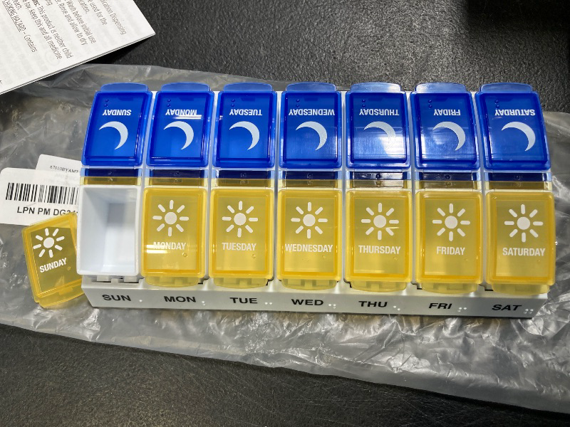 Photo 1 of Ezy Dose Weekly (7-Day) AM/PM Pill Organizer, Vitamin and Medicine Box, Large Pop-Out Compartments, Designed for Travel, 2 Times a Day, Blue and Yellow Lids
