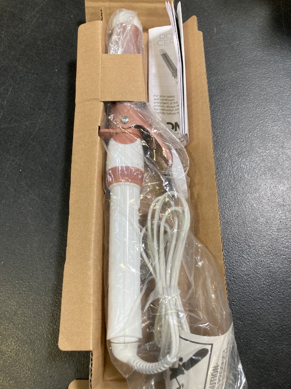 Photo 1 of Conair Double Ceramic 1 1/4-Inch Curling Iron, 1 ¼ inch barrel produces loose curls – for use on medium and long hair