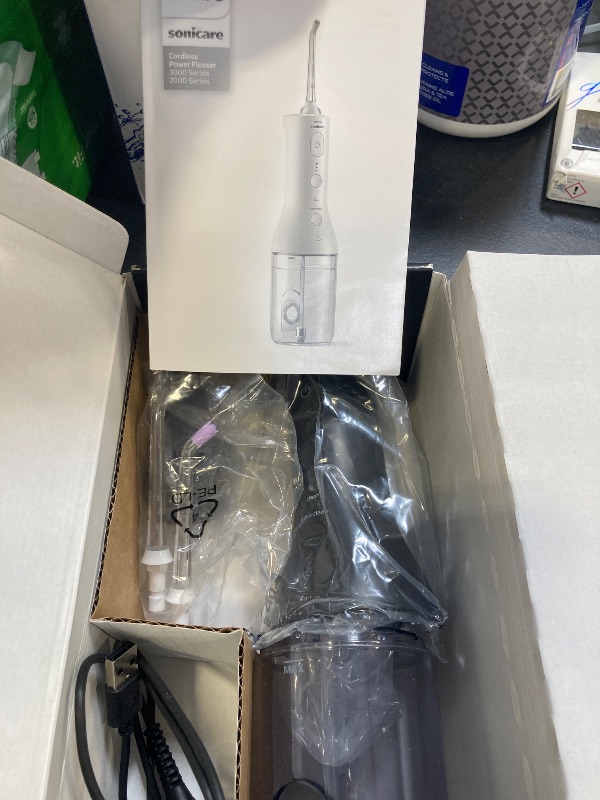 Photo 1 of Philips Sonicare Cordless Power Flosser 3000, Water Flosser with Innovative Quad Stream Technology, Oral Irrigator with 2 Flossing Modes and 3 Intensity Levels, Ergonomic Design, Black, HX3826/23